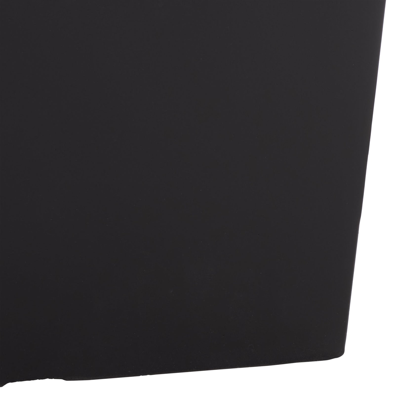 The tapered black base ends in a softly rounded corner with a sleek, smooth finish. || PAT1544A || leg_studio
