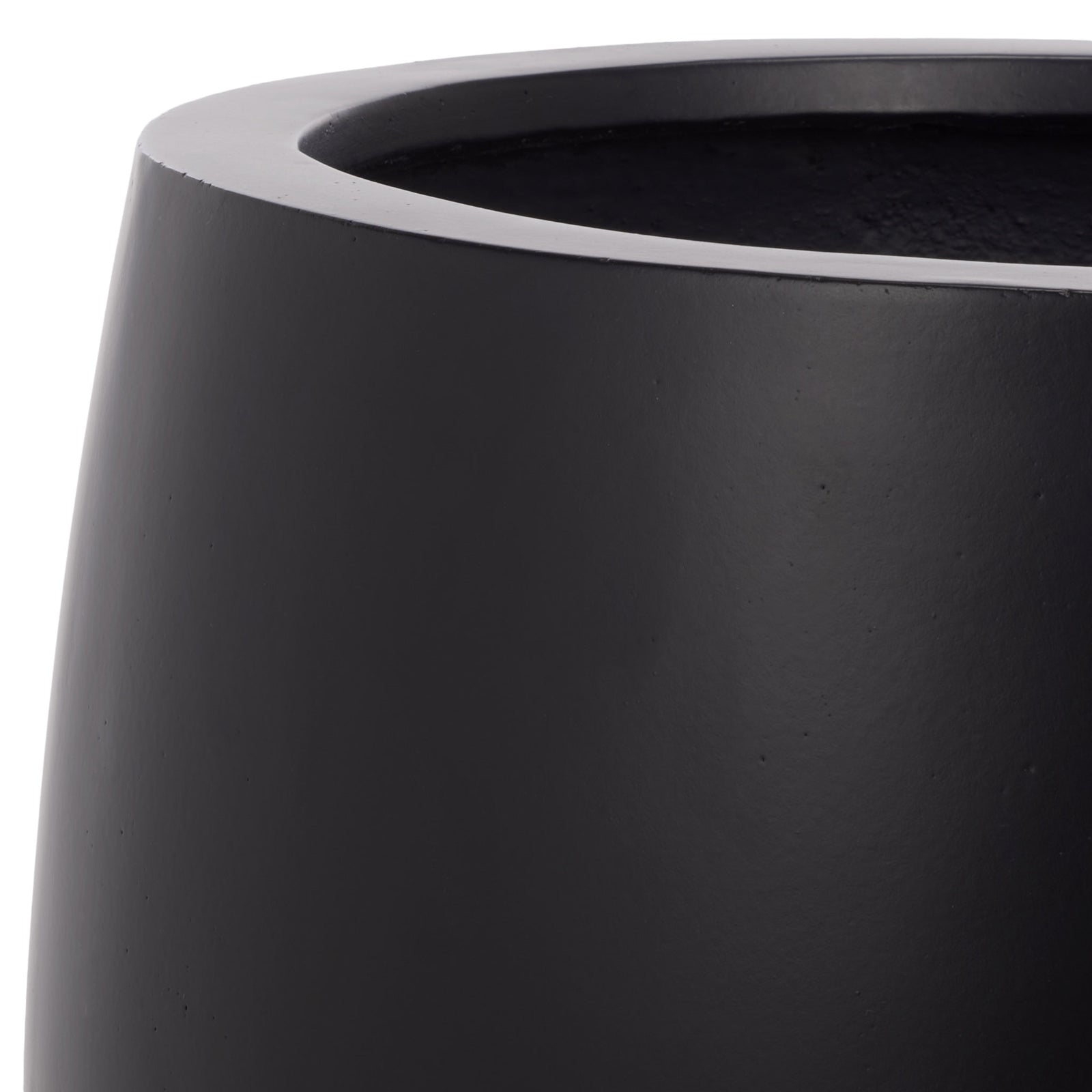 A thick rounded rim meets the smooth black surface of the planter's curved bowl || PAT1545A || detail_studio