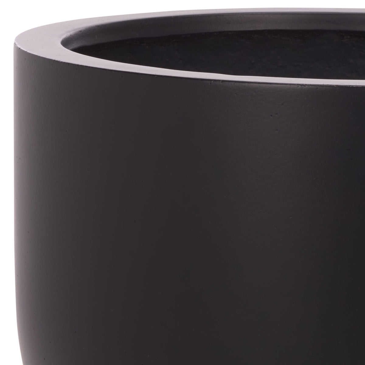 Smooth black planter bowl features a wide rim and a softly rounded outer wall. || PAT1546A || detail_studio