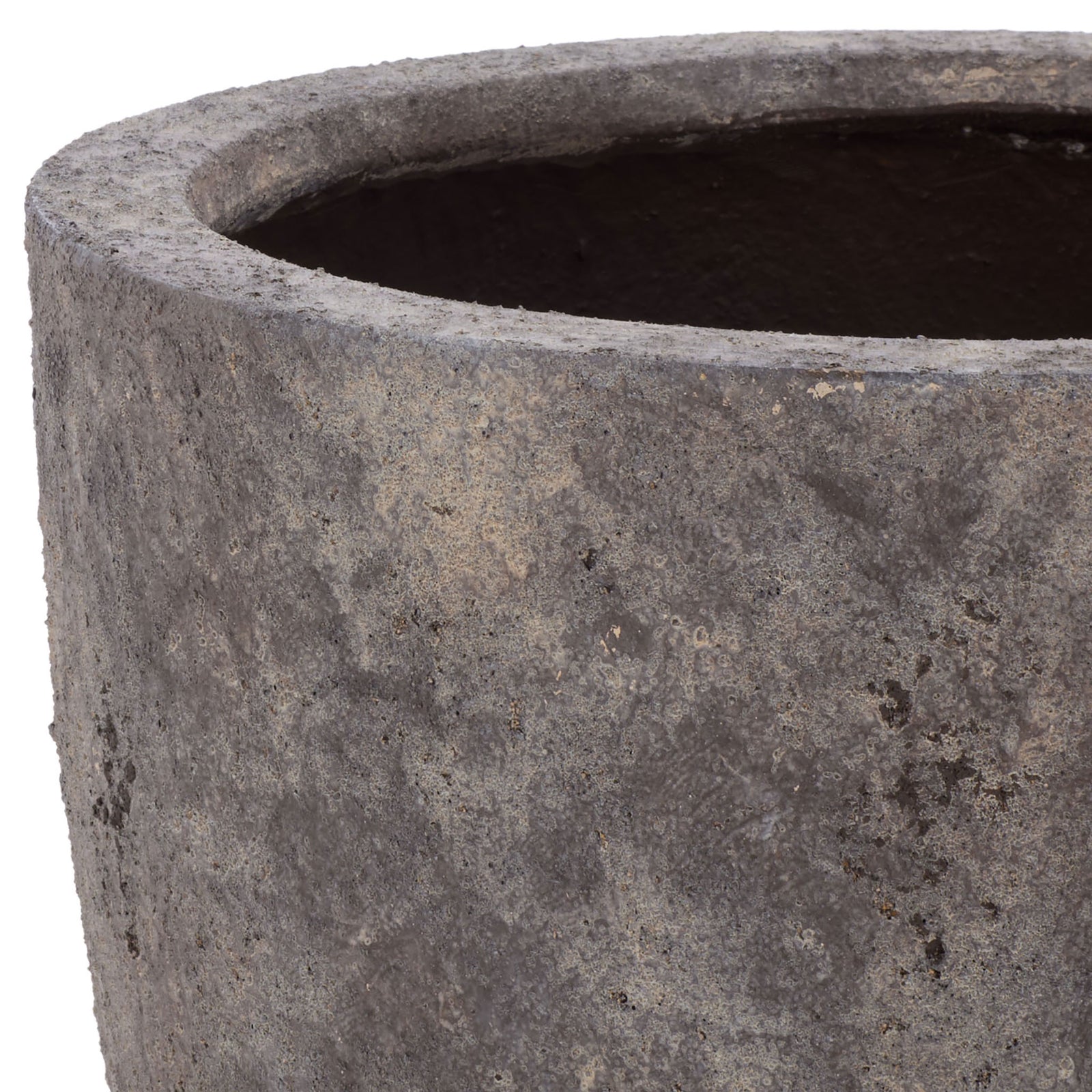The thick, rounded rim meets a richly mottled, stone-textured antique brown exterior. || PAT1549A || detail_studio