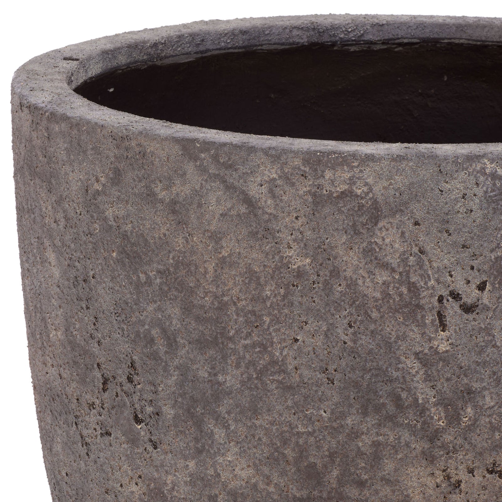 The large planter's rounded lip frames a deep interior above its weathered brown exterior. || PAT1550A || detail_studio