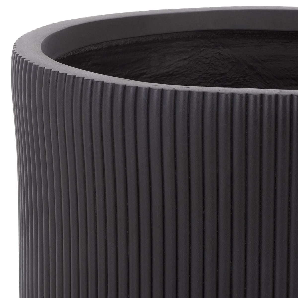 A sturdy black rim borders the planter's open basin and deep vertical fluting.
