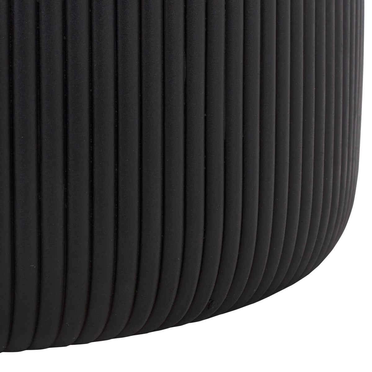 Deep fluting continues down the black planter's gently curved lower edge.