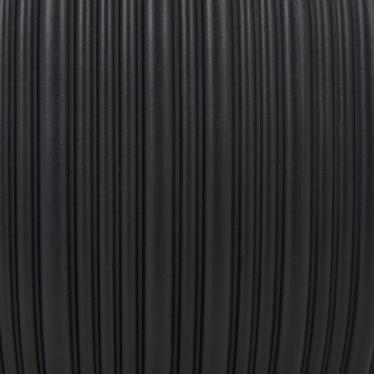 Light catches the closely spaced grooves of the matte black finish. || PAT4602A-SET3 || swatch_studio