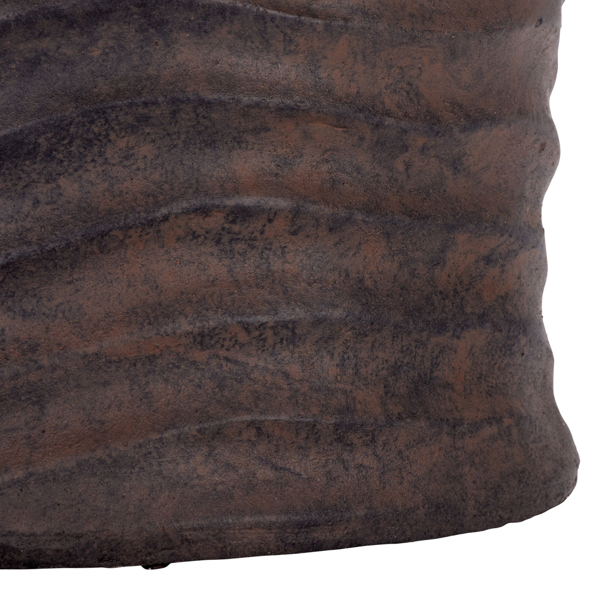 Deep earthy tones highlight the brown planter's textured, gently curved base