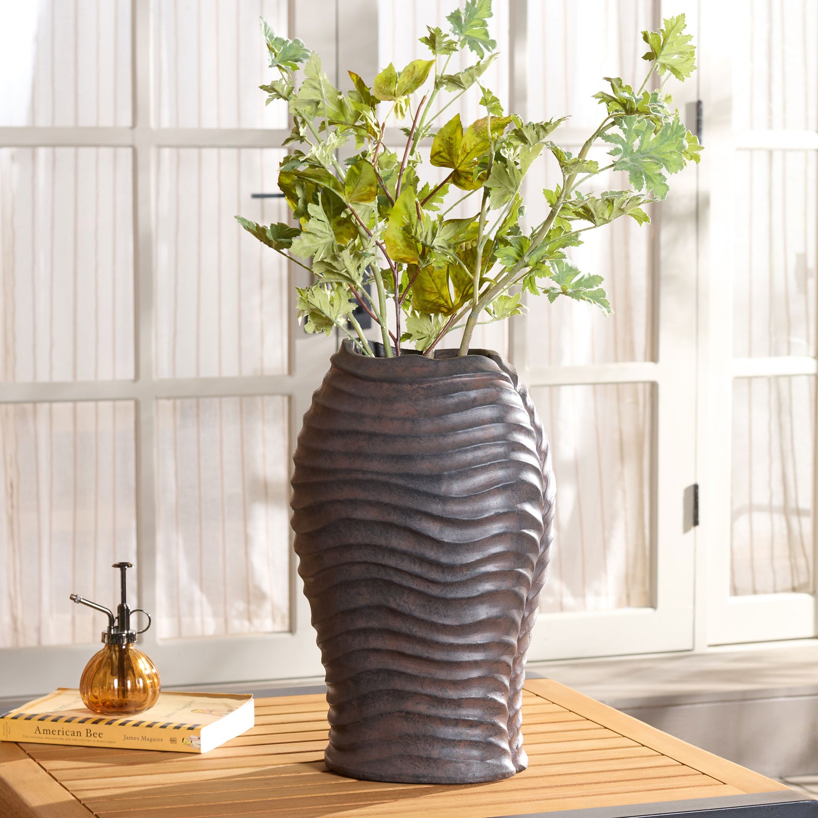 Greenery arranged in the ribbed brown planter complements its warm, earthy finish || PAT5043B || front_room