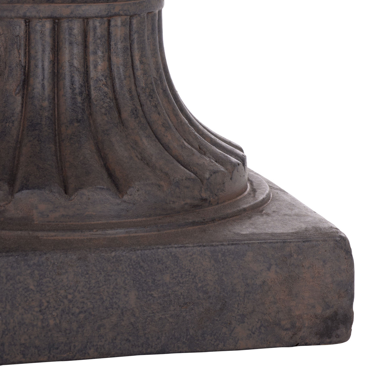 The brown planter rests on a square base, with ribbed contours climbing its sculpted pedestal.