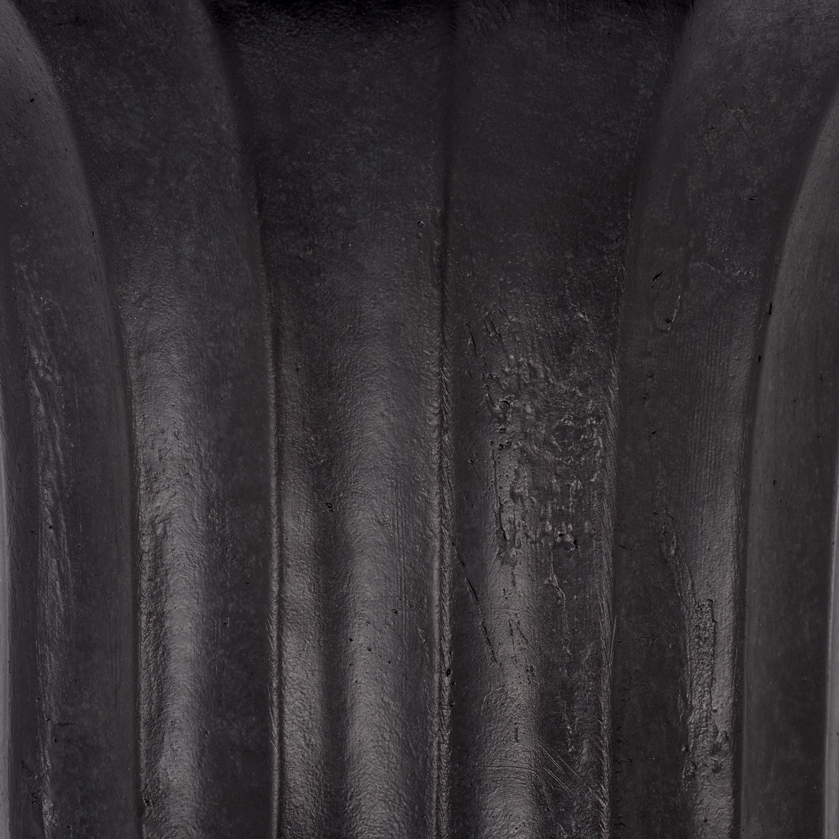 A softly mottled black finish and gentle sheen bring depth to the planter's molded fluting. || PAT5045E || swatch_studio