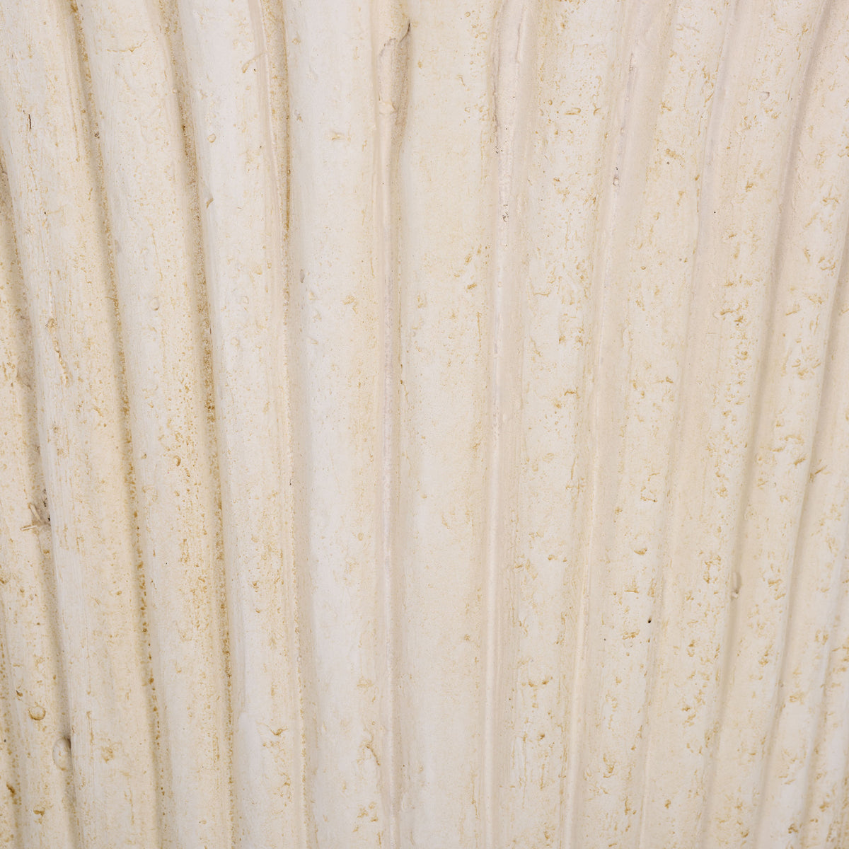 Soft off-white coloring and fine speckling accent the planter's raised flutes || PAT5047A || swatch_studio