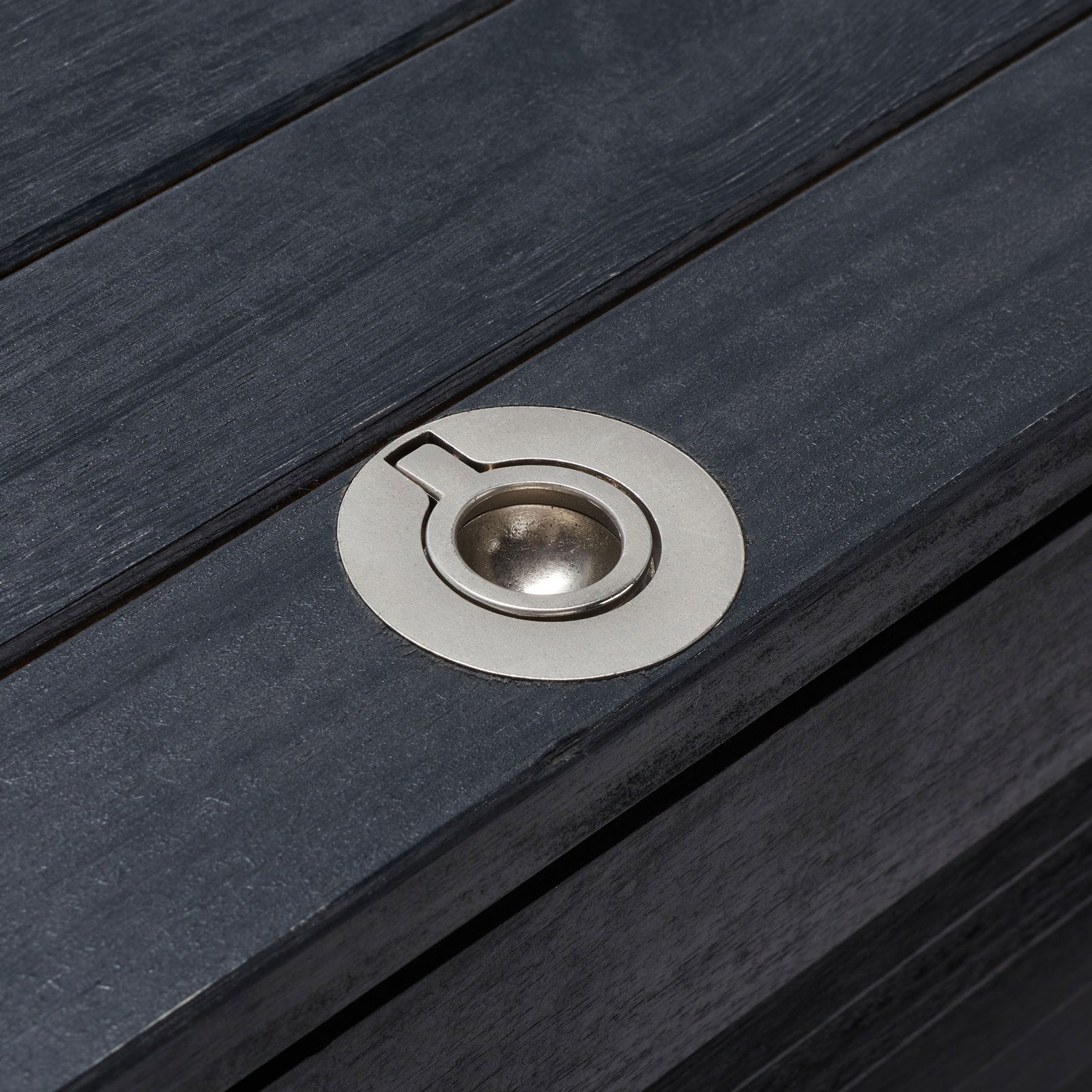 A recessed silver ring pull lies flush in the black slatted lid for easy access || PAT7038D || handle_studio