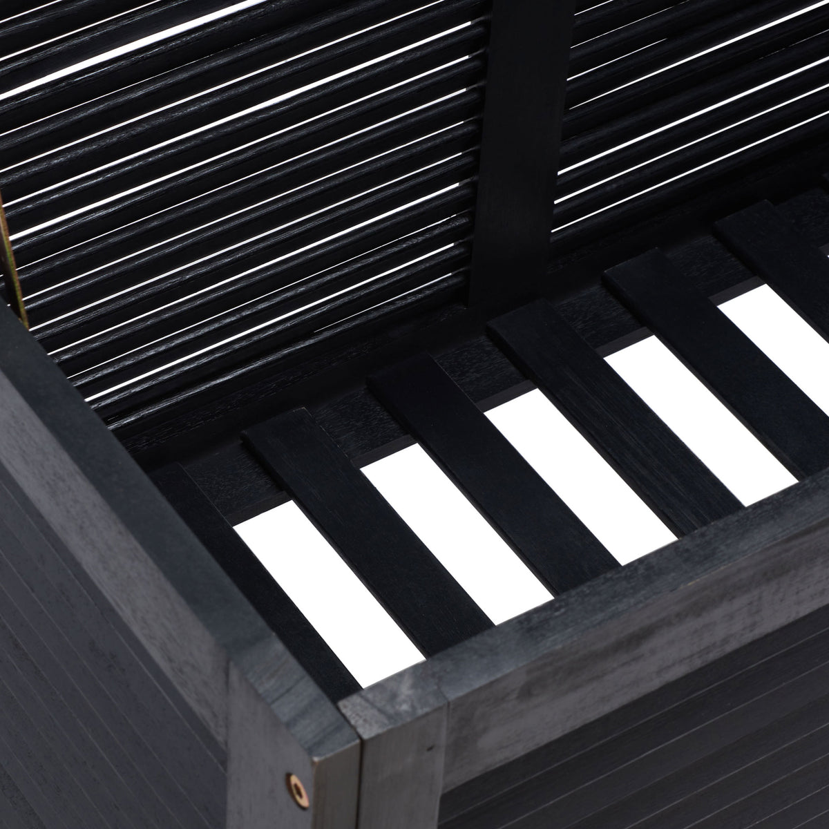 Slatted black wood base and louvered walls create airy storage for outdoor cushions || PAT7038D || storage_open_studio