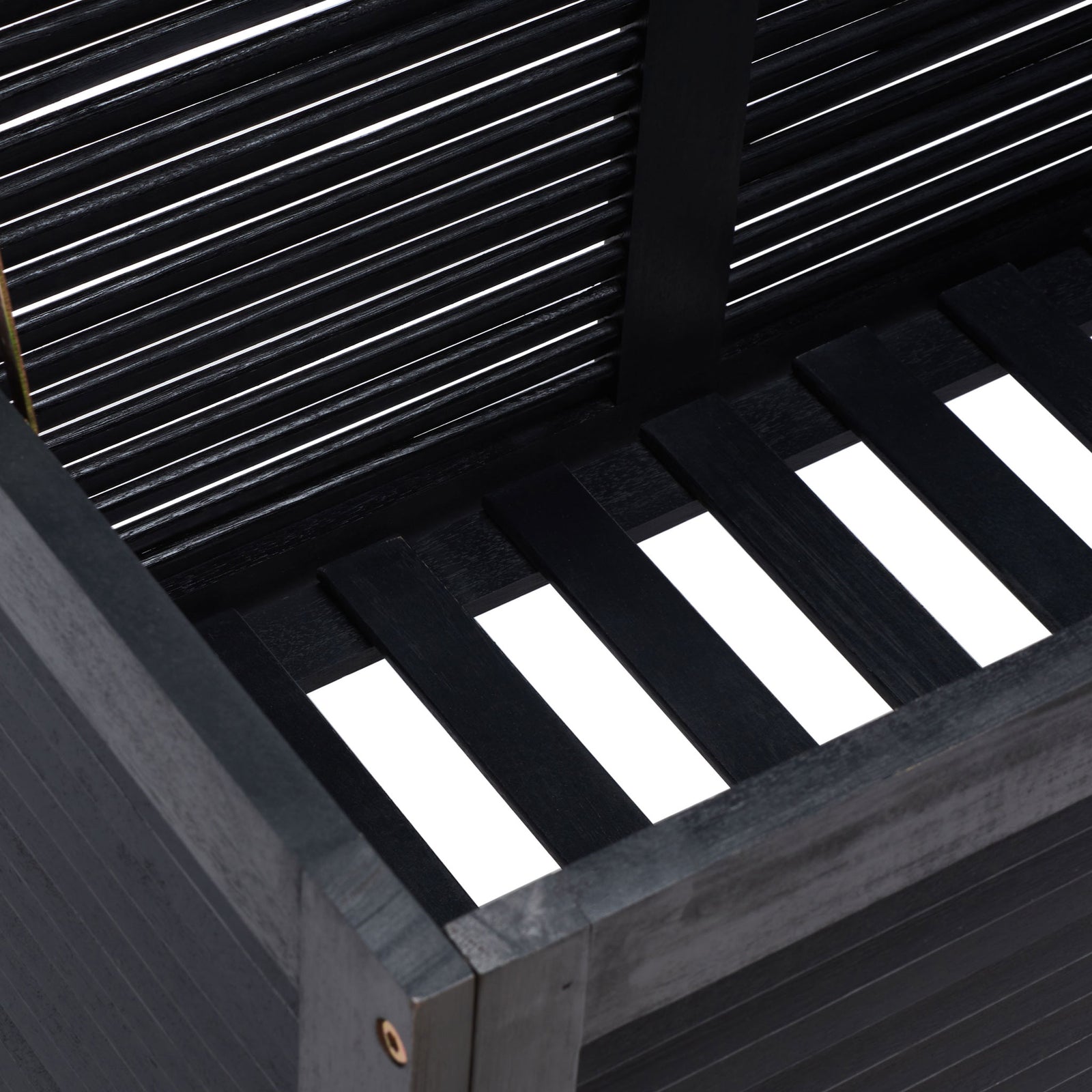 Slatted black wood base and louvered walls create airy storage for outdoor cushions || PAT7038D || storage_open_studio