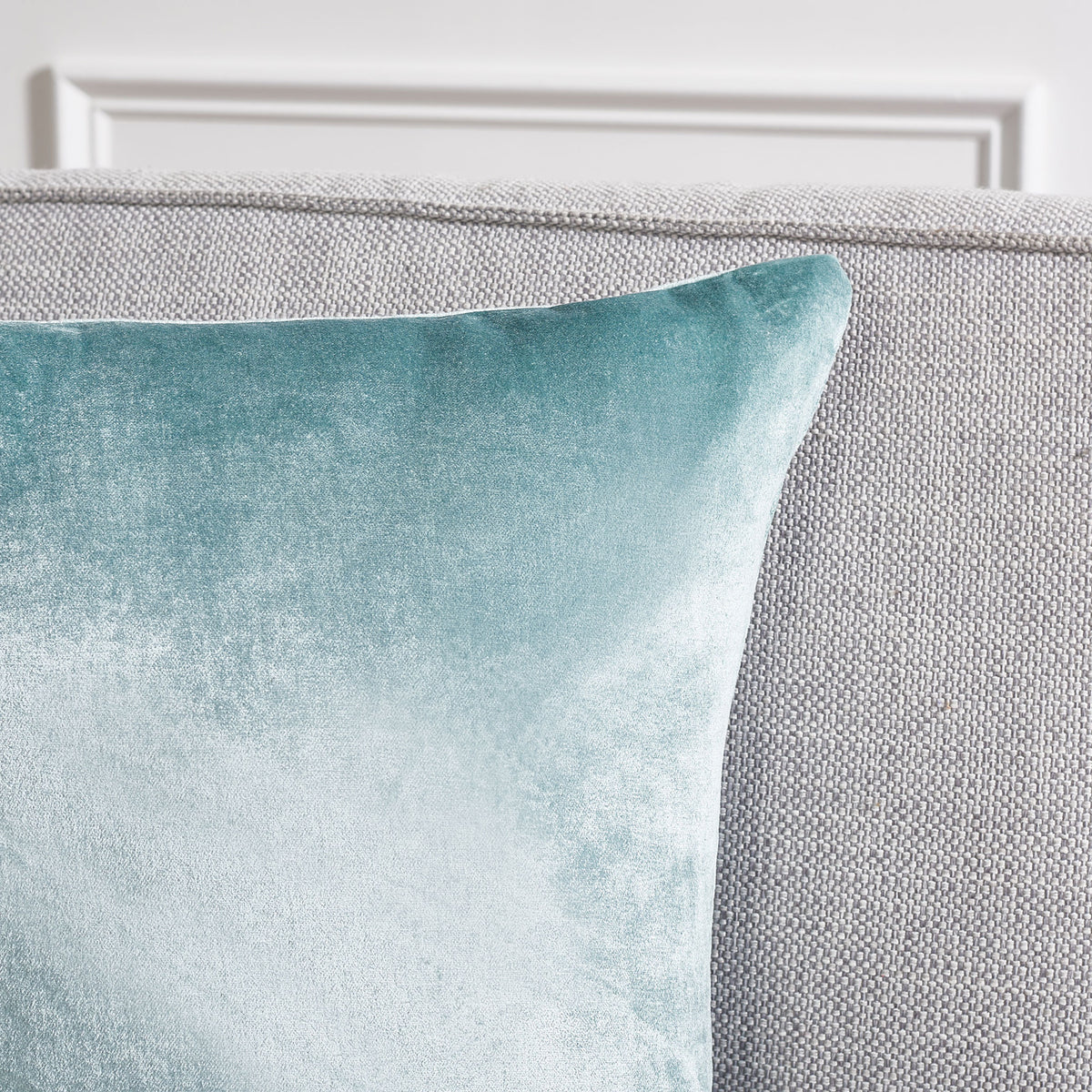 Aqua pillow fabric shimmers with delicate texture along a neatly sewn upper edge. || PLS500B-1818-SET2 || detail_room
