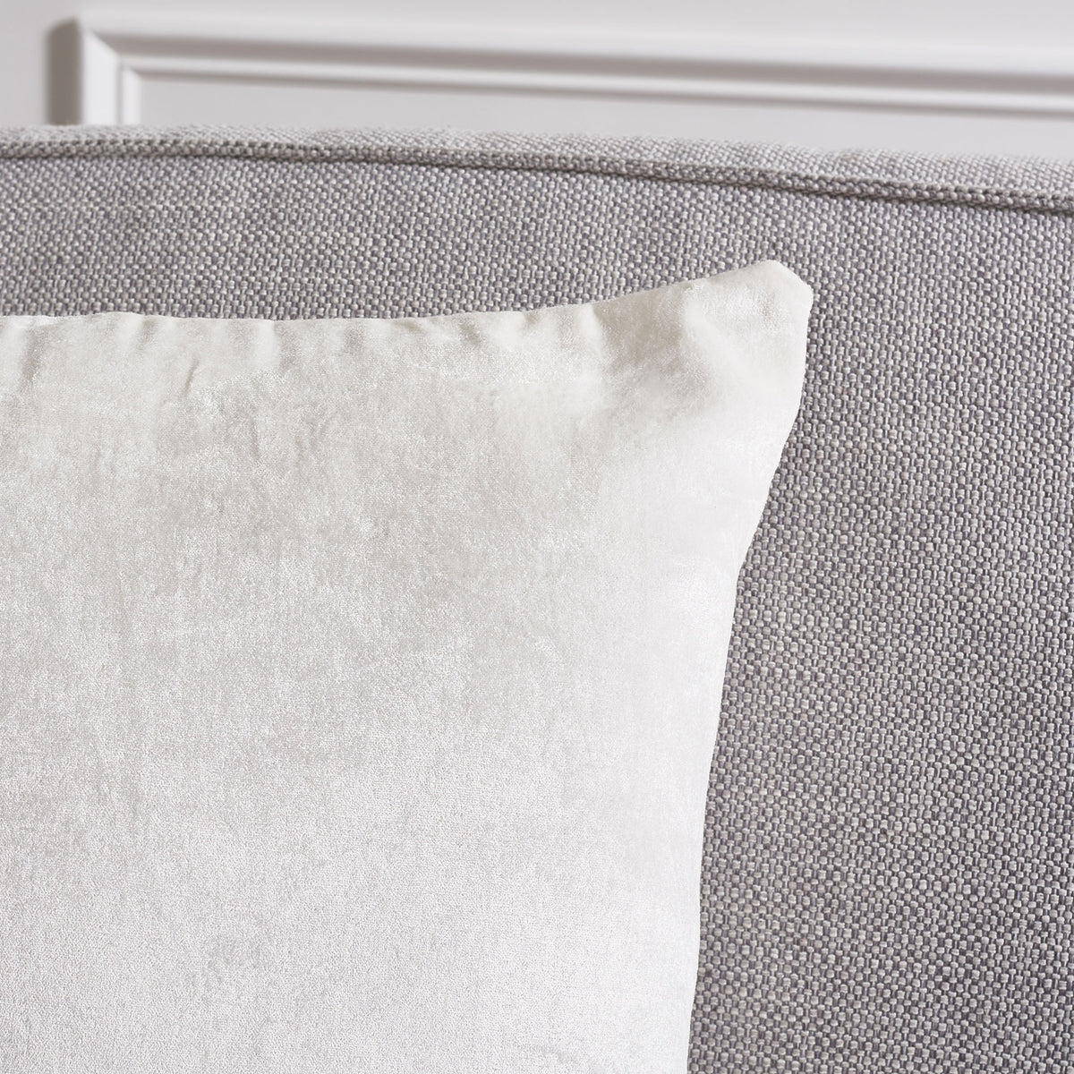 The ivory pillow's softly shaped corner reveals its smooth, subtle sheen || PLS503A-1818-SET2 || detail_room