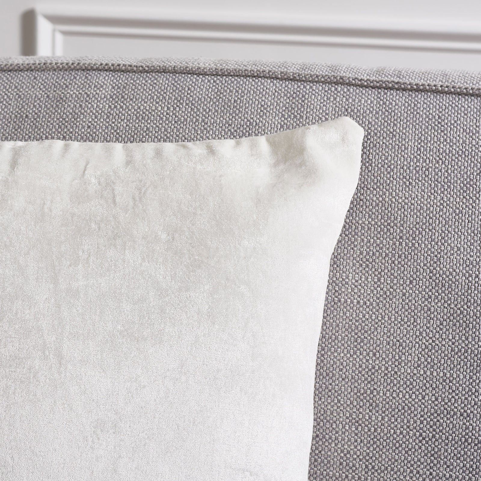 The ivory pillow's softly shaped corner reveals its smooth, subtle sheen || PLS503A-1818-SET2 || detail_room