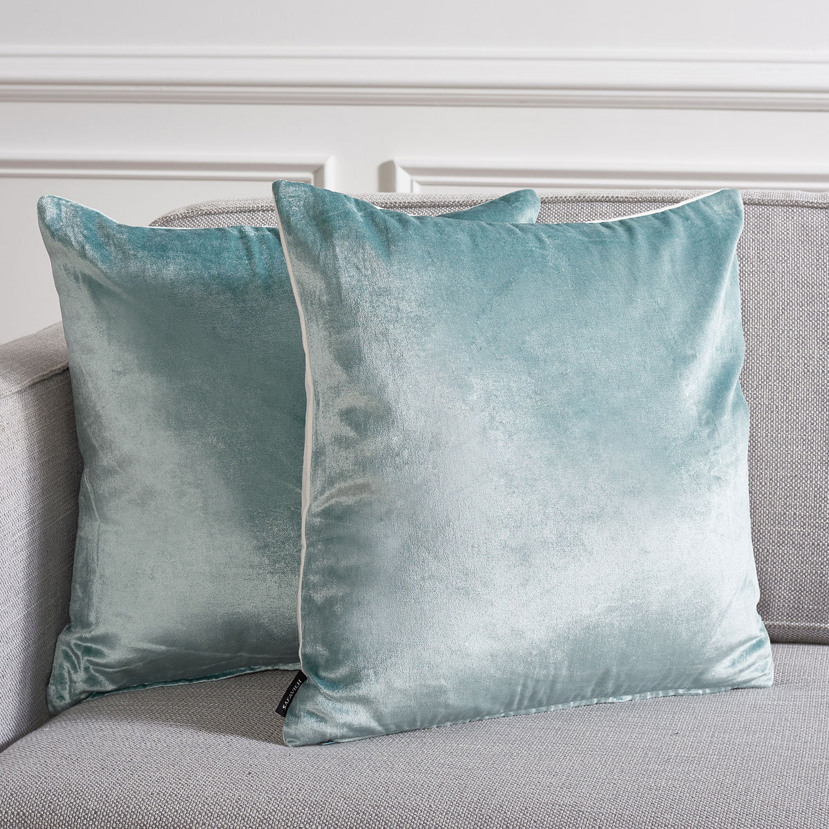Aqua pillows add a soothing, light-catching touch to a textured gray sofa || PLS503B-1818-SET2 || front_multi_room