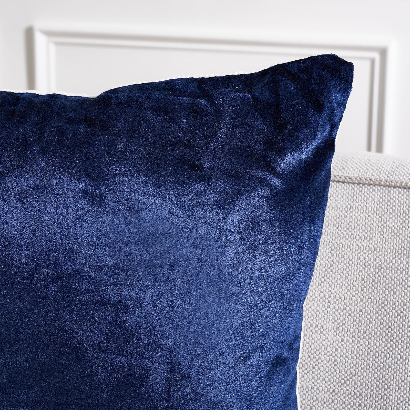Rich navy fabric shifts in the light across the pillow's softly shaped corner || PLS503C-2222-SET2 || detail_room