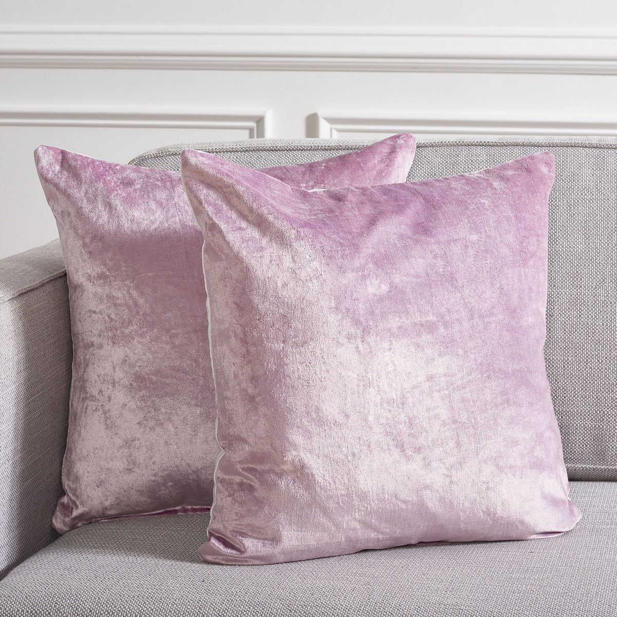 Two lavender pillows add a delicate wash of color to a neutral sofa || PLS503D-1818-SET2 || front_multi_room