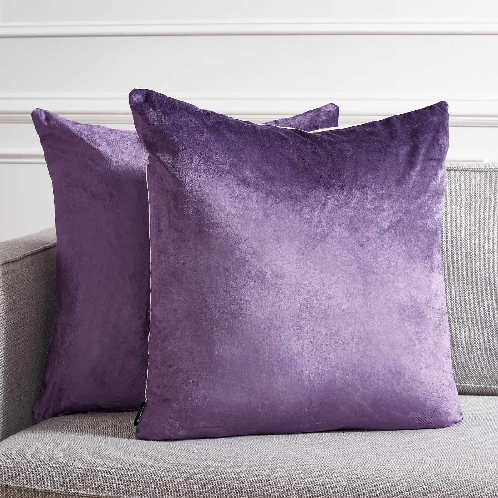 Deep purple pillows brighten a pale sofa with rich color and lustrous texture || PLS503E-2222-SET2 || front_multi_room