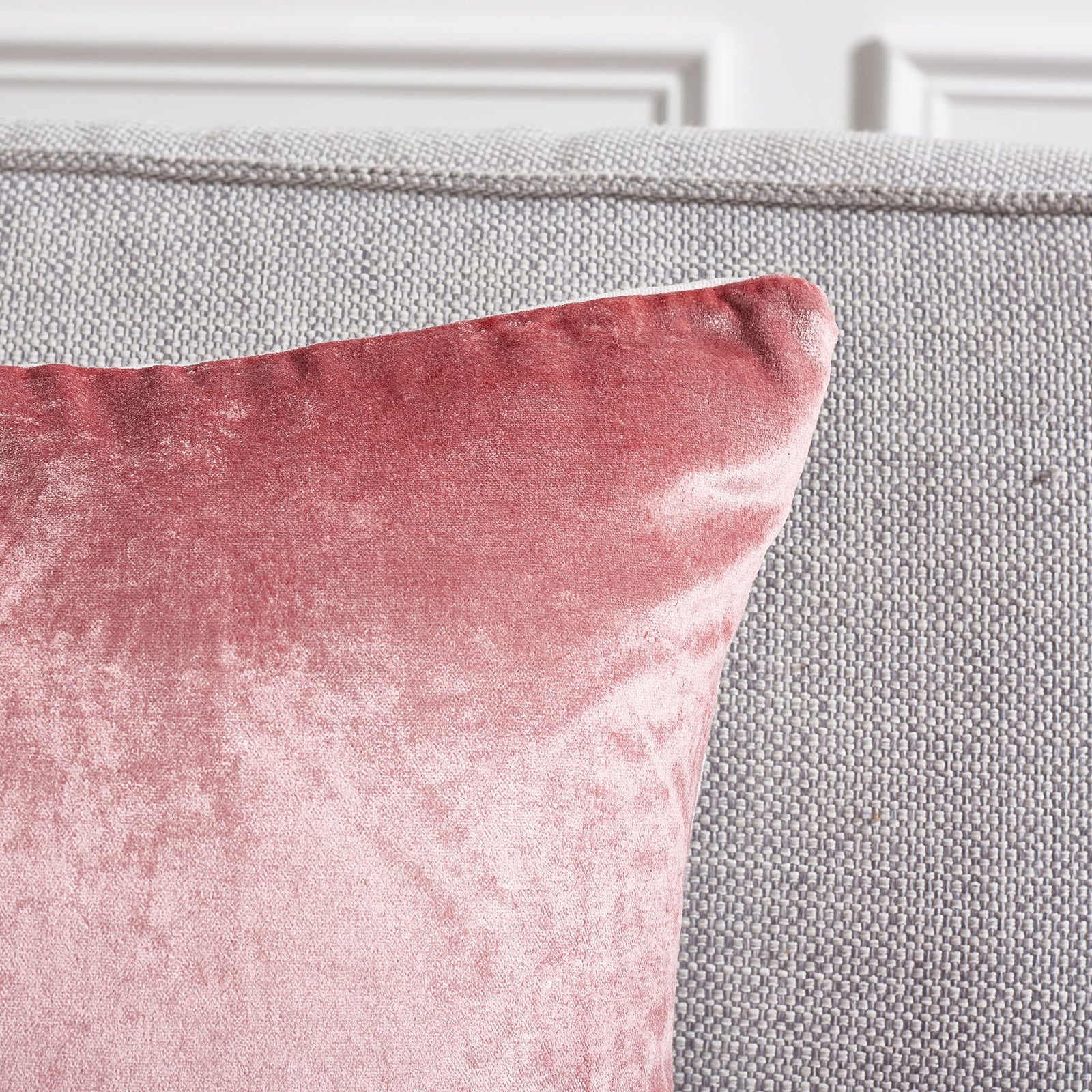 The pink pillow's shaped corner highlights its rosy sheen and tidy edge seam || PLS503F-1818-SET2 || detail_room