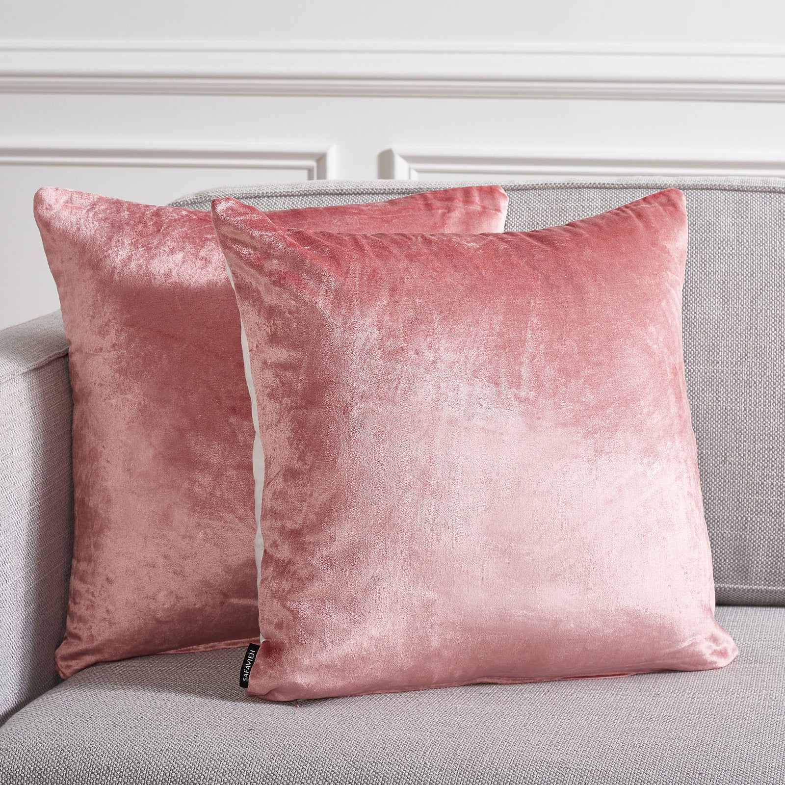 Two pink pillows warm a gray sofa with their soft color and light-catching finish || PLS503F-1818-SET2 || front_multi_room