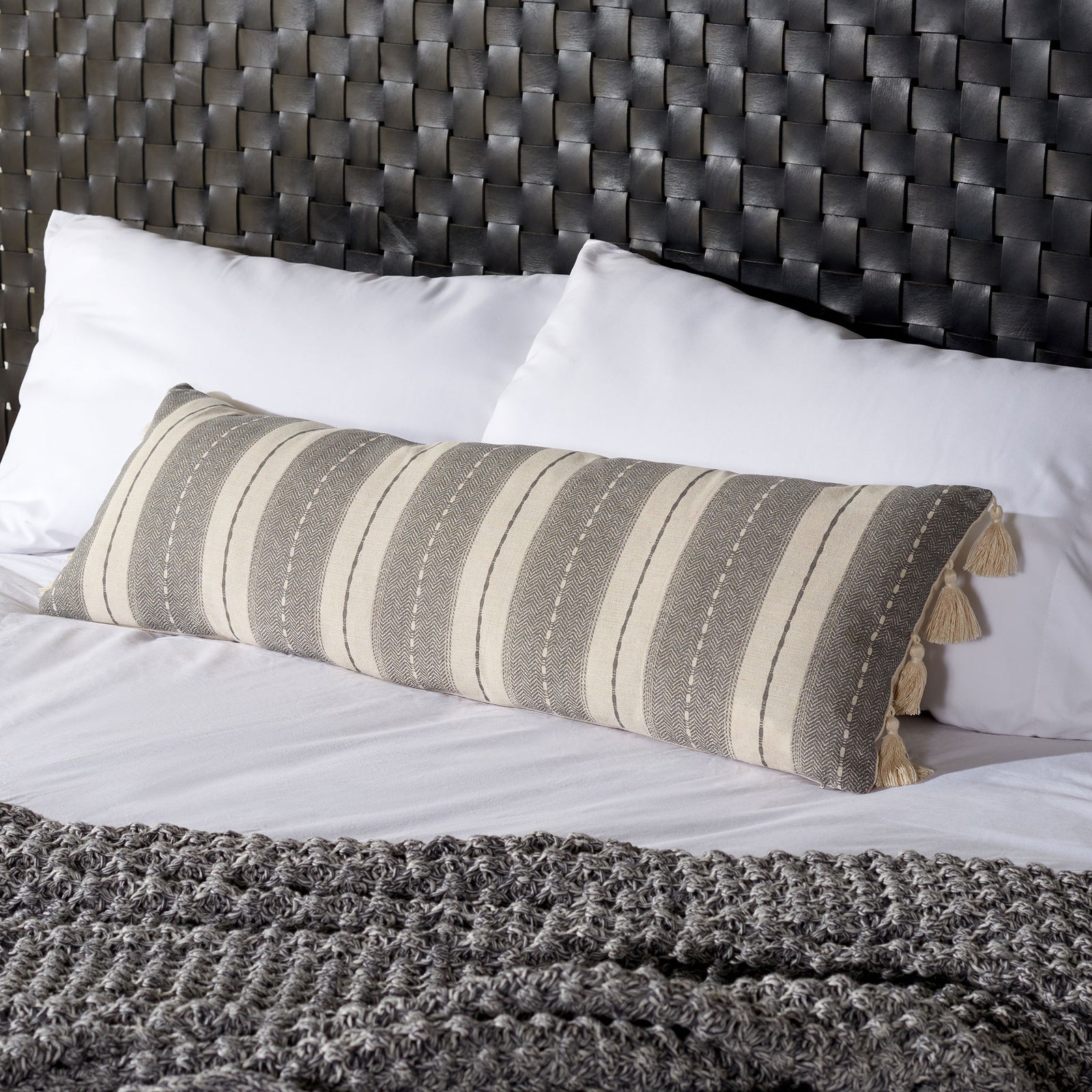 Woven gray and beige stripes and cream tassels bring cozy pattern to a bedroom || PLS7165A-1236 || front_angle_room