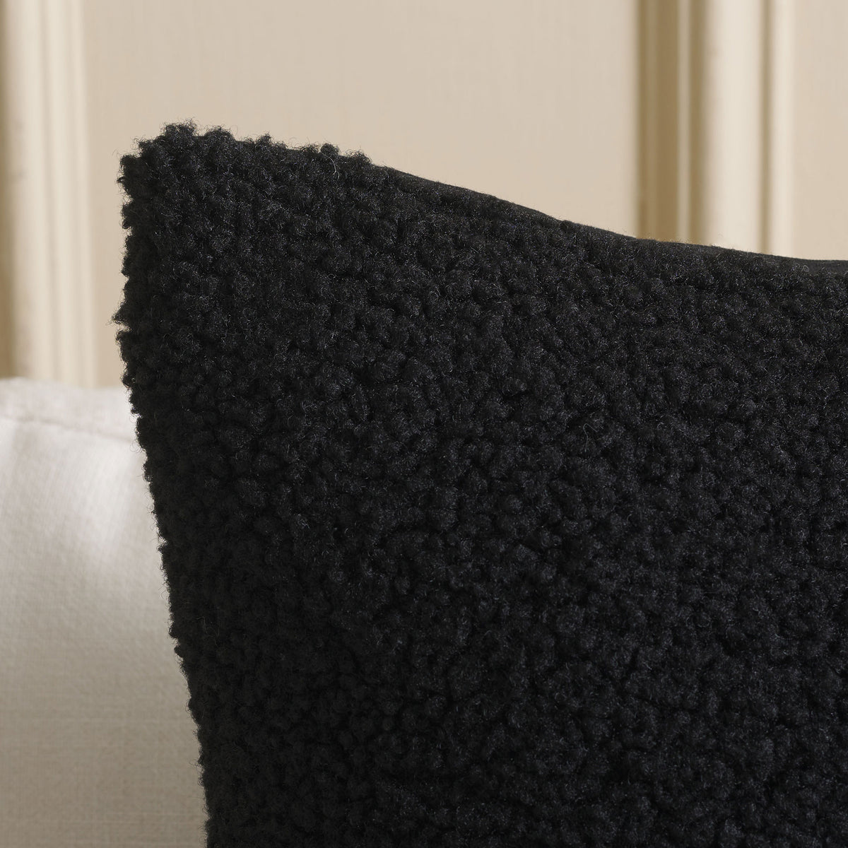 Plush black fabric gives the pillow a soft, nubby texture. || PLS7221A-2020 || detail_room