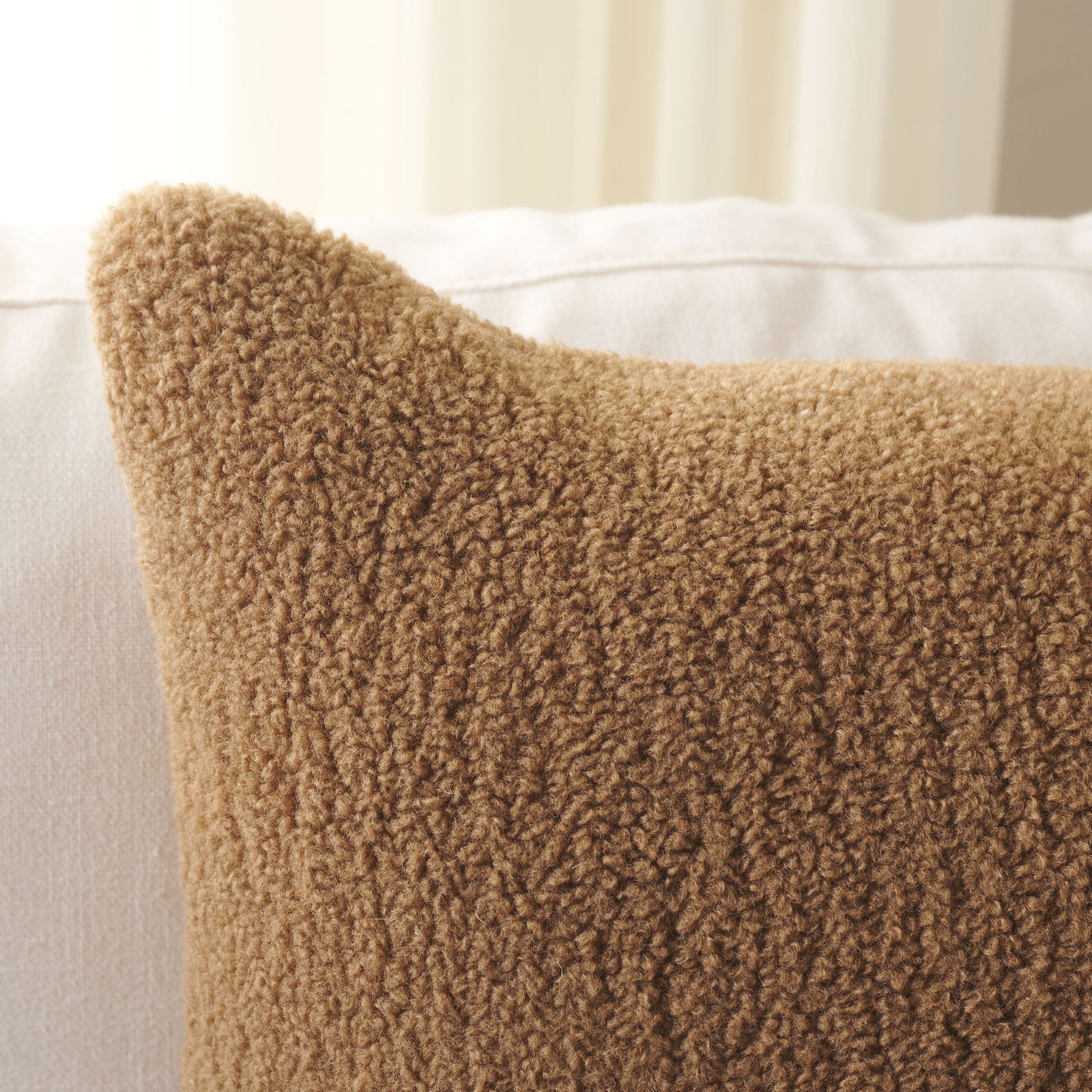 Camel-colored nubby fabric gives the pillow a plush, inviting texture. || PLS7221B-2020 || detail_room