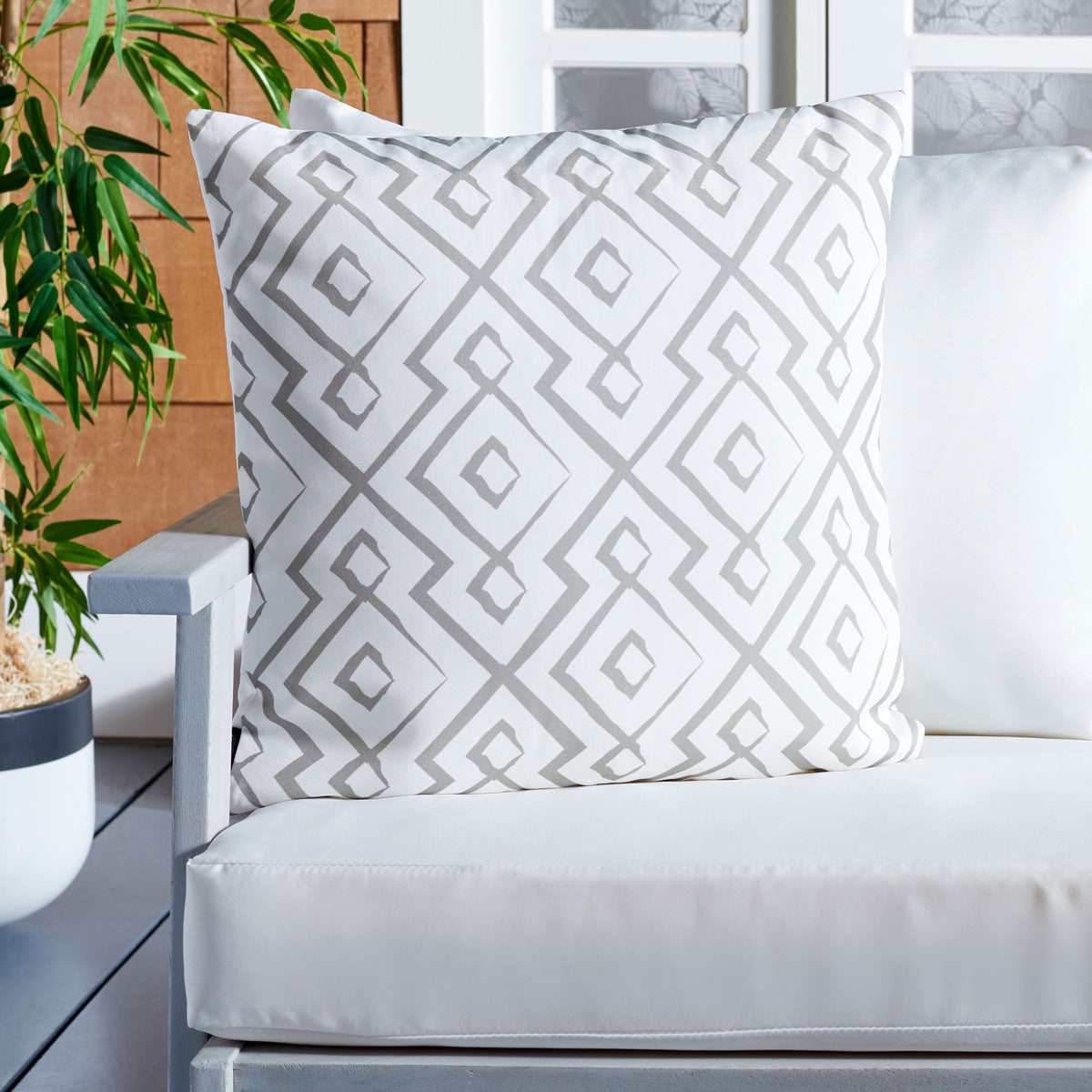 Layered gray diamonds bring understated graphic style to a generously filled outdoor pillow. || PPL260B-1818 || front_room