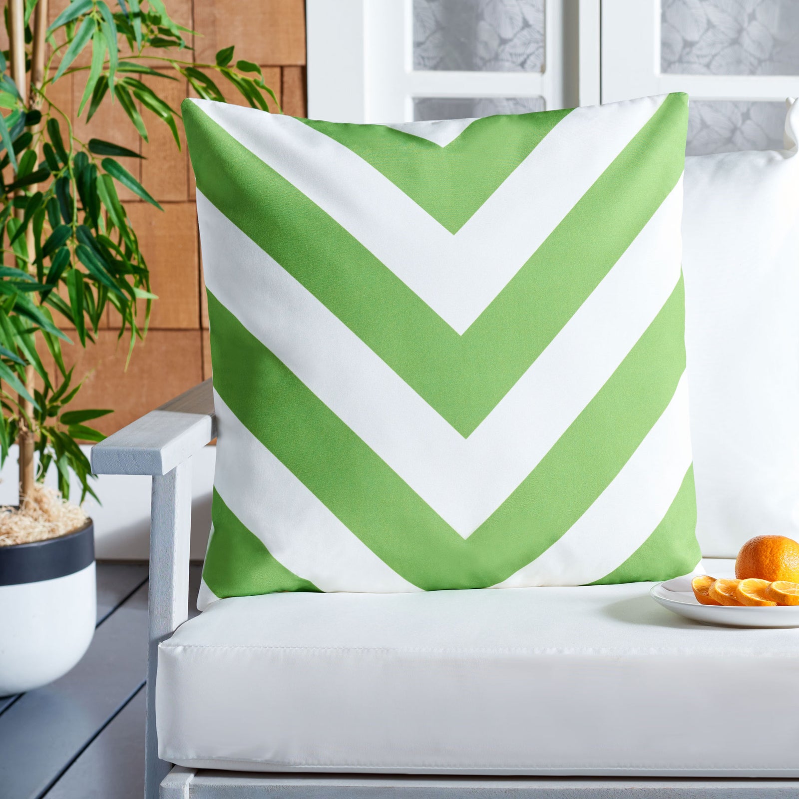 Fresh green chevrons bring a playful burst of color to a cushioned outdoor chair. || PPL262D-1818 || front_room