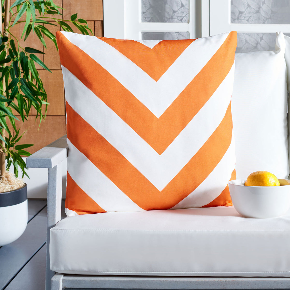 Bright orange chevrons add a sunny splash of color to an outdoor lounge chair. || PPL262F-1818 || front_room
