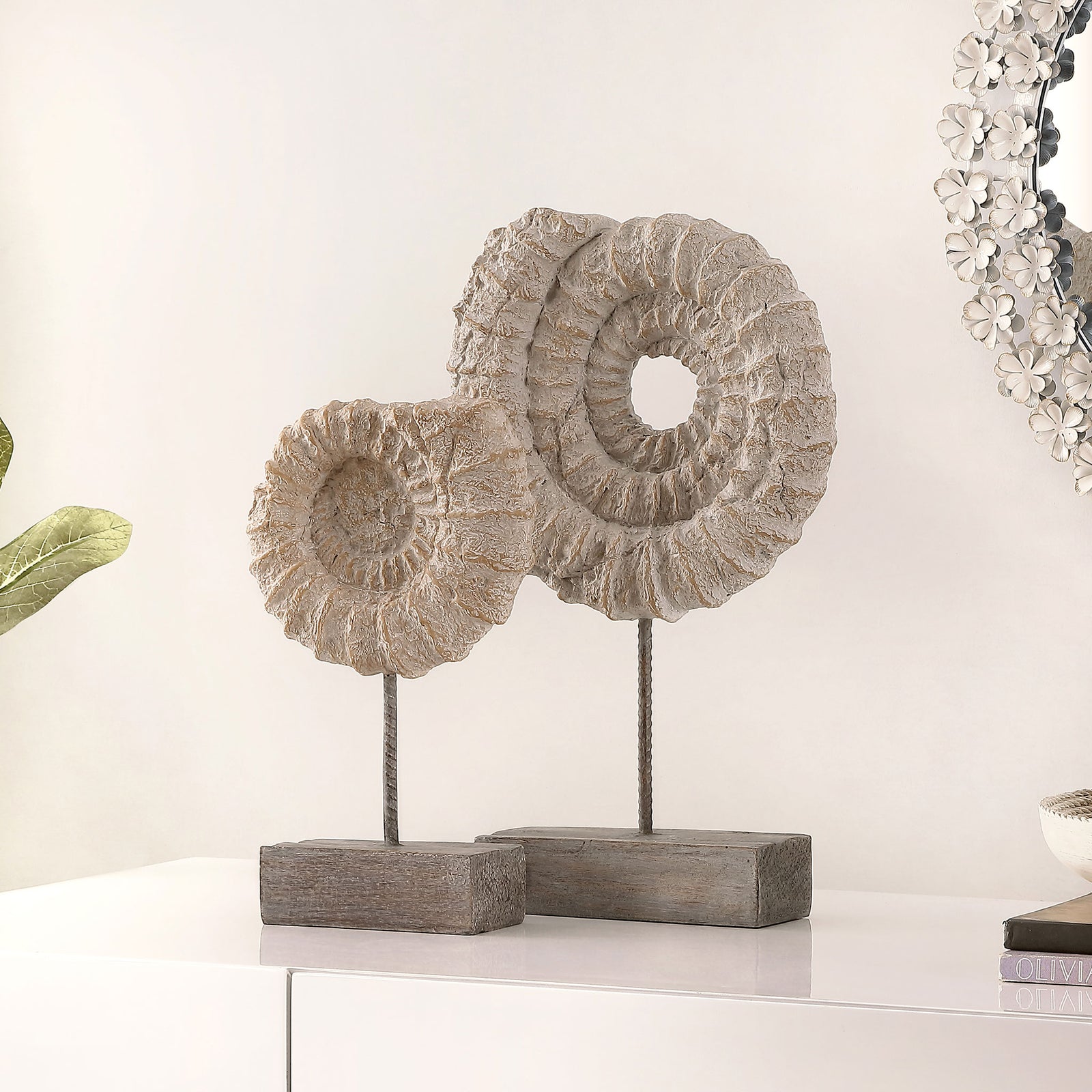 Ribbed ammonite shells on slender metal stems add organic texture to a tabletop. || RDC1207A-SET2 || front_room
