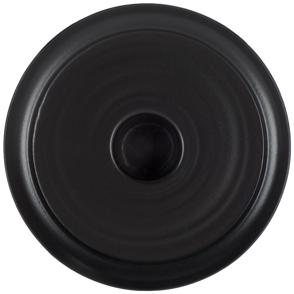 Round black candle plate has a raised rim and a recessed center for a taper