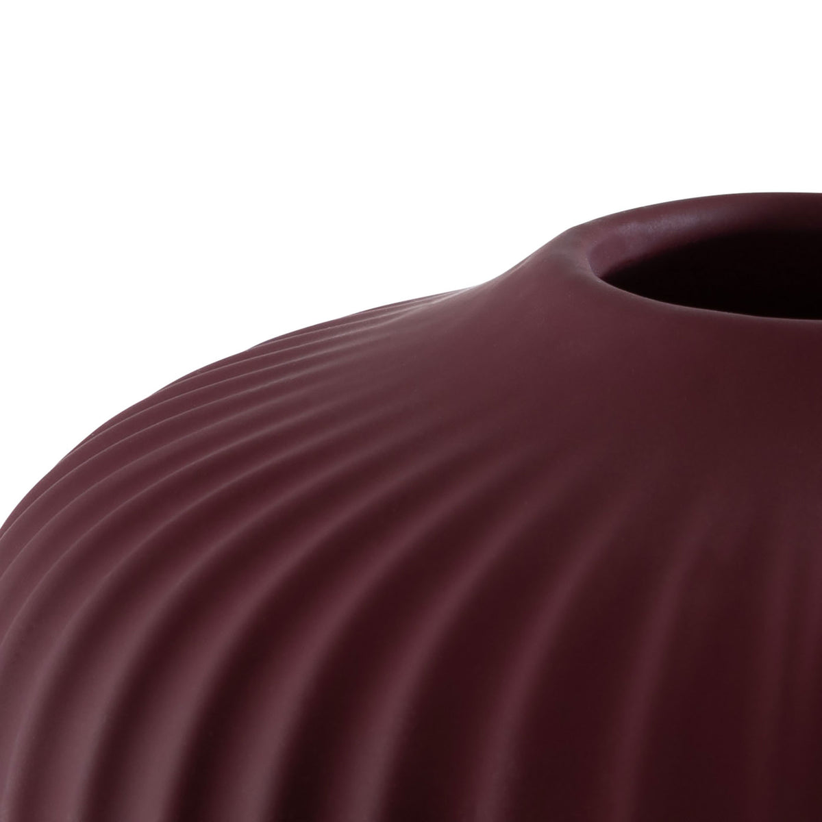 Burgundy ceramic vase with curved fluting leading to a narrow circular opening || RDC4000B-SET3 || detail_studio