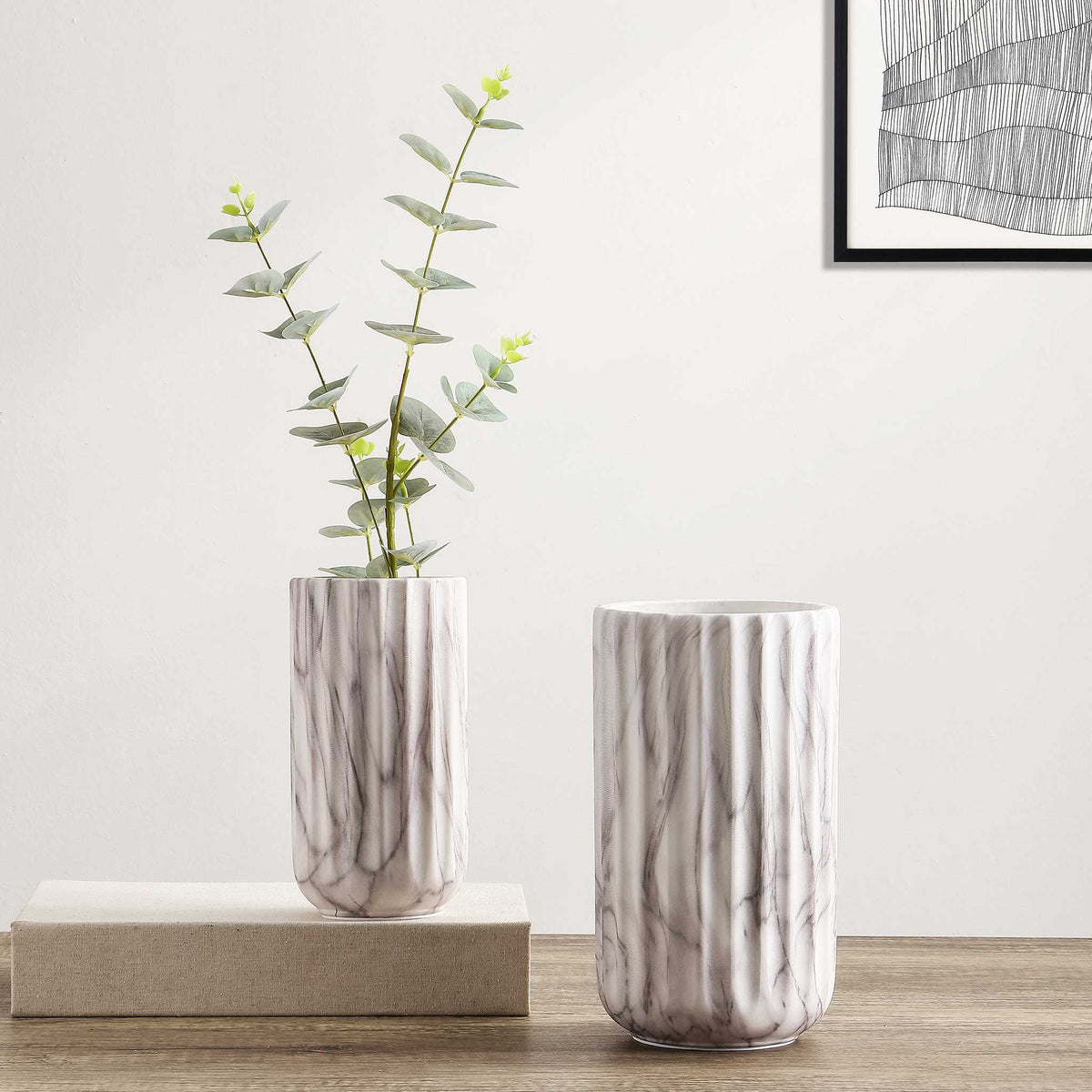 Pair of fluted white marble ceramic vases bring airy elegance to a tabletop display || RDC4022A-SET2 || front_room
