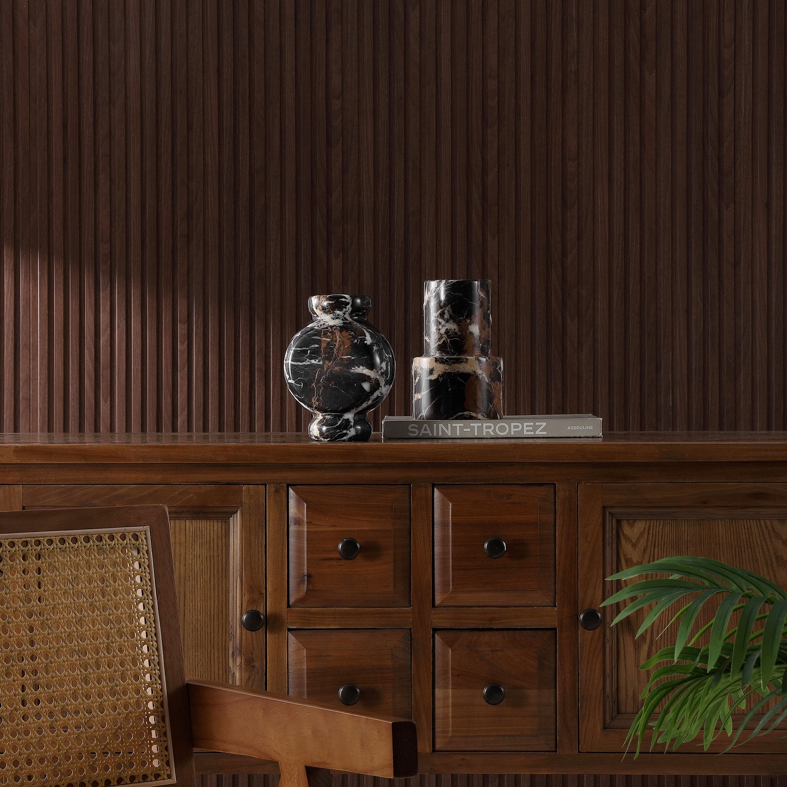 Two black marble vases add sculptural contrast and natural veining to a richly grained wood console || RDC4024A-SET2 || front_room