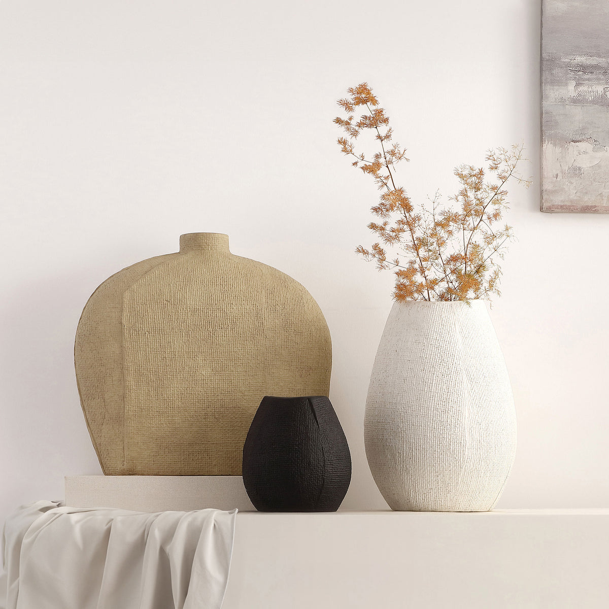A sandy beige vase pairs with sculptural white and black accents for a warm, layered display. || RDC4028A-SET3 || front_room