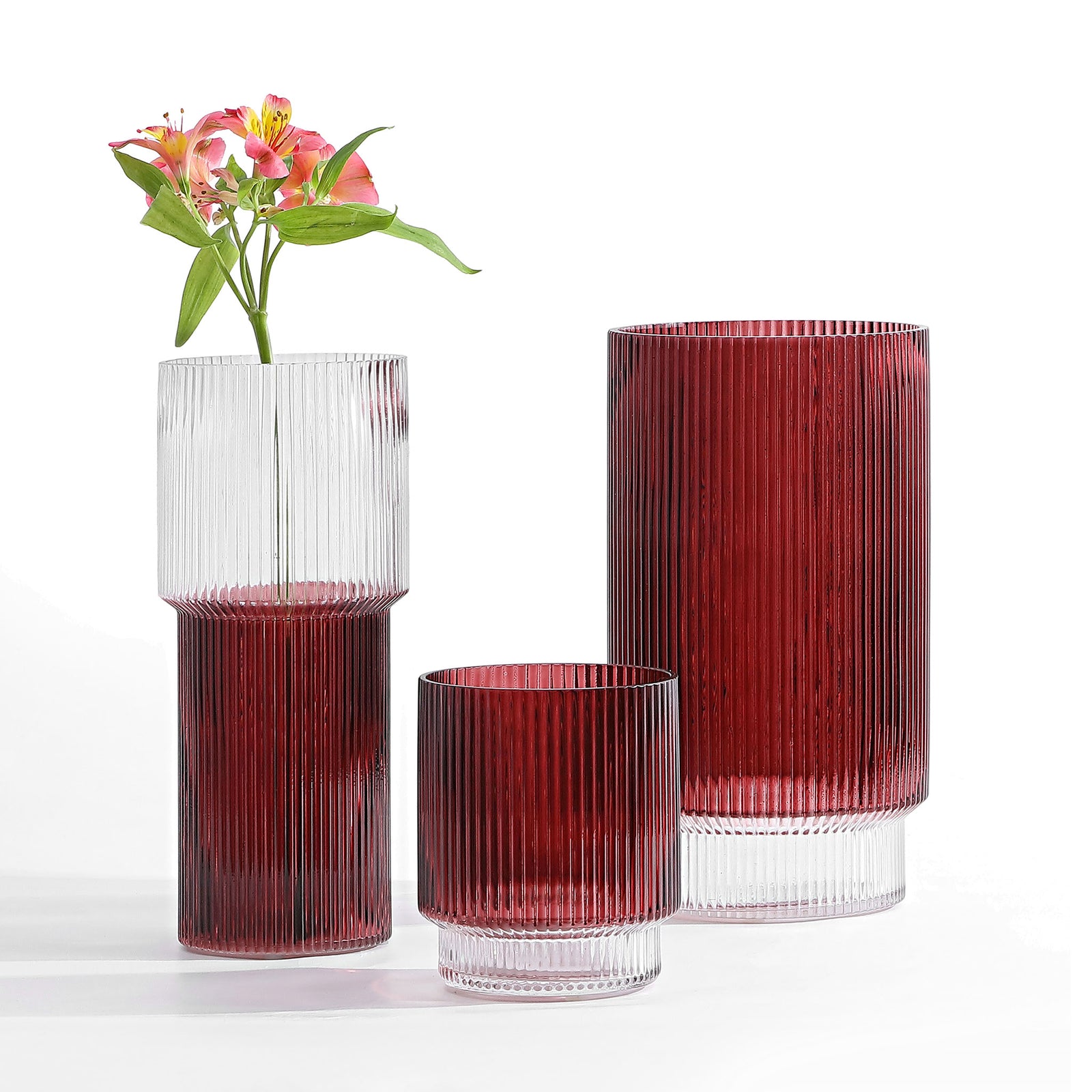 Cranberry fluted glass vases pair rich color and clear accents with delicate blooms. || RDC4034B-SET3 || front_angle_studio