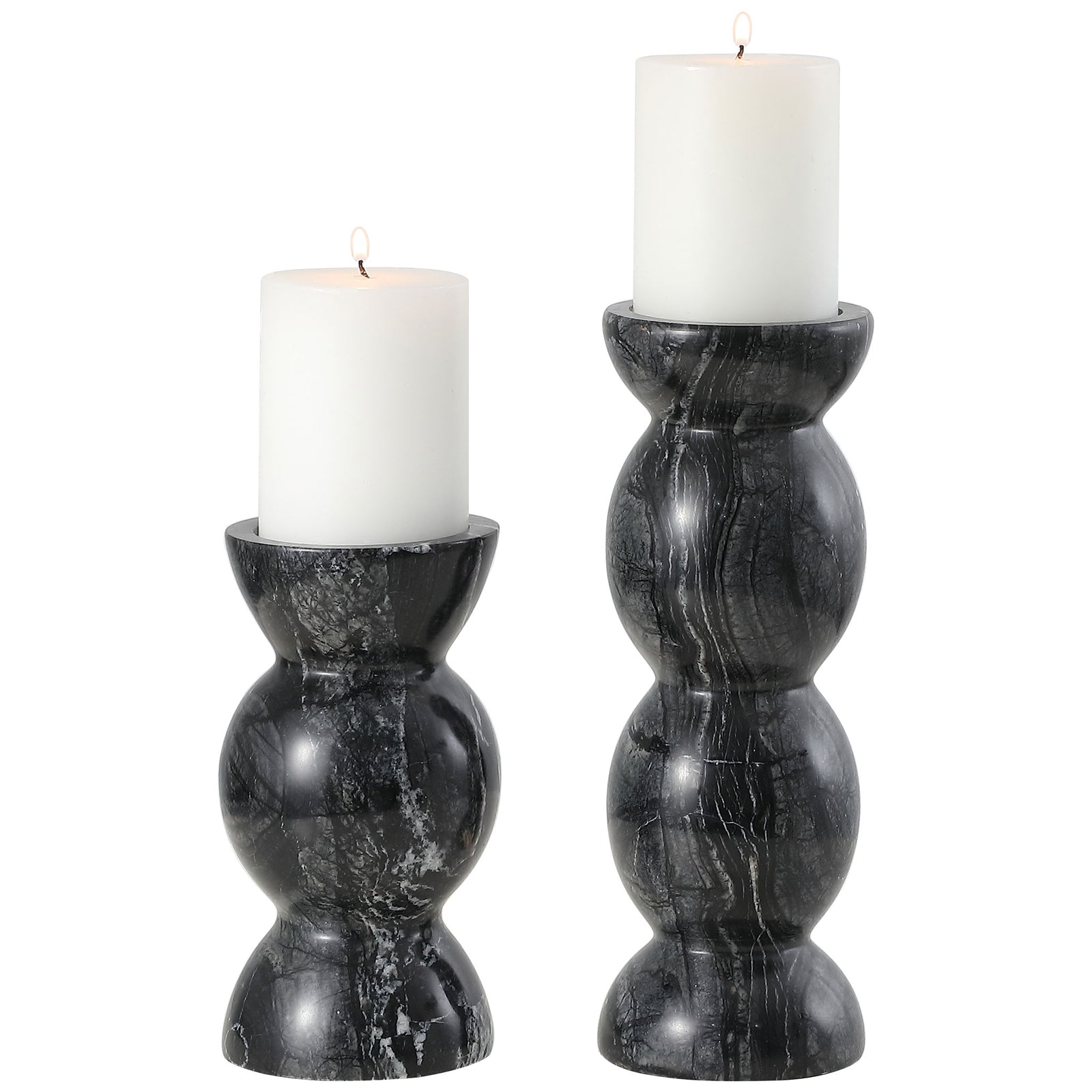 White pillar candles rest in two sculptural gray marble holders with softly rounded forms. || RDC4037A-SET2 || front_studio