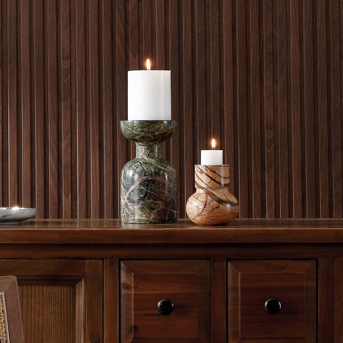 Dark green veining and warm tan swirls lend natural contrast to the marble holders beneath lit candles. || RDC4038A-SET2 || front_room