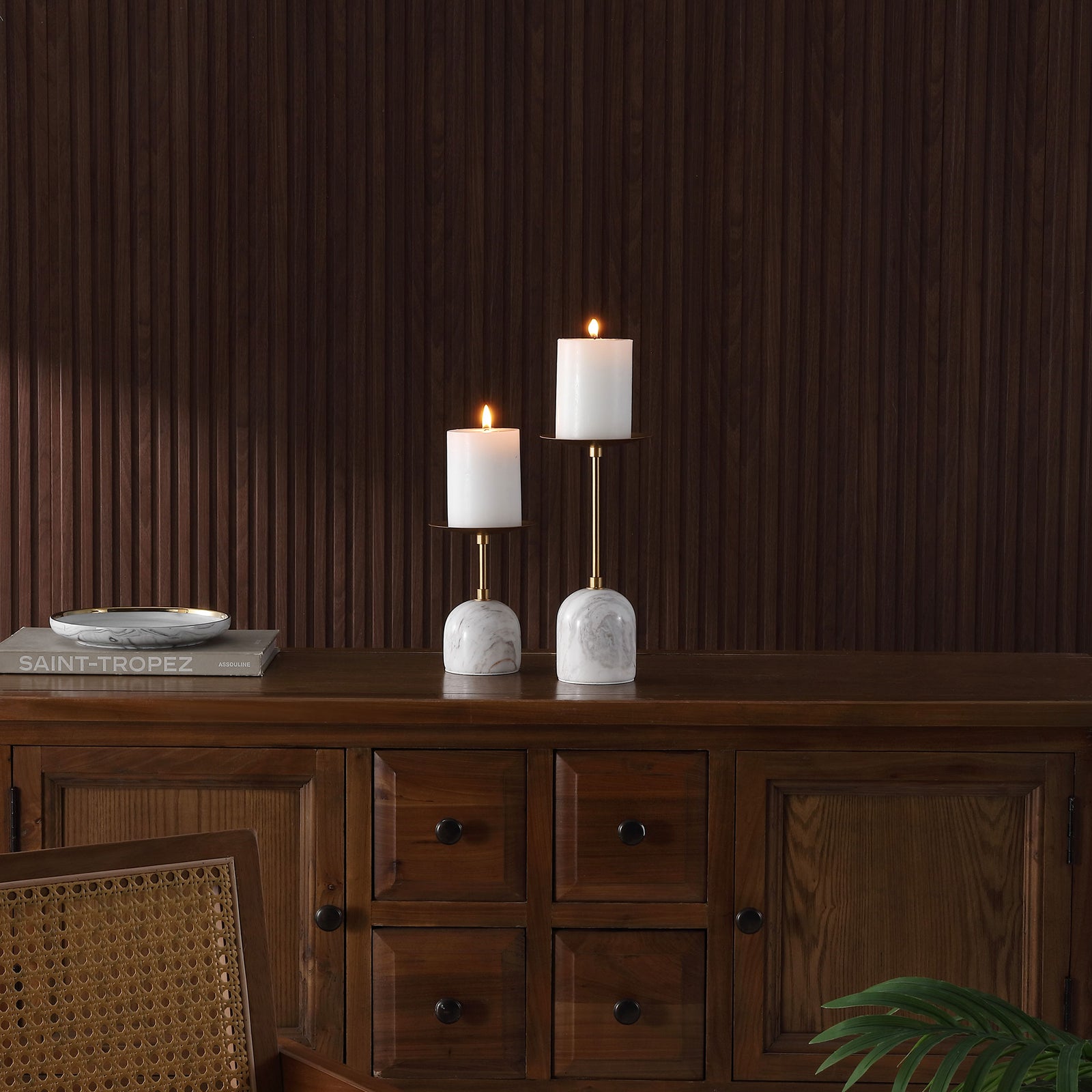 Lit pillar candles add warmth to the gold-tone holders and rounded marble bases atop a wood sideboard. || RDC4042A-SET2 || front_room
