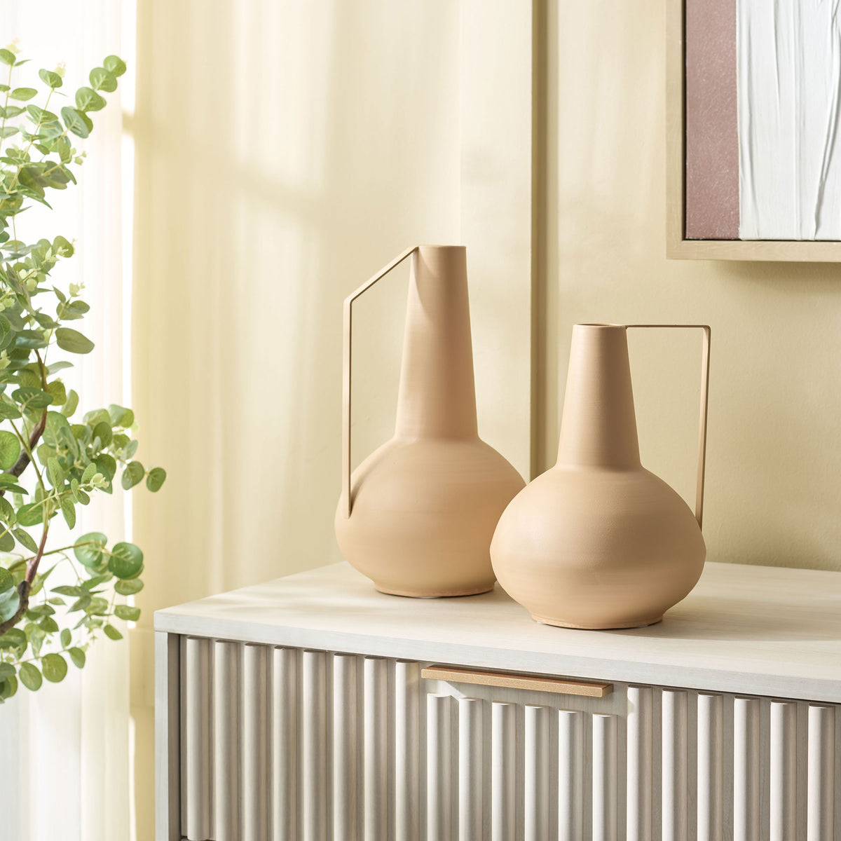 Beige iron vases in two heights bring sculptural warmth to a modern console. || RDC4049A-SET2 || front_room
