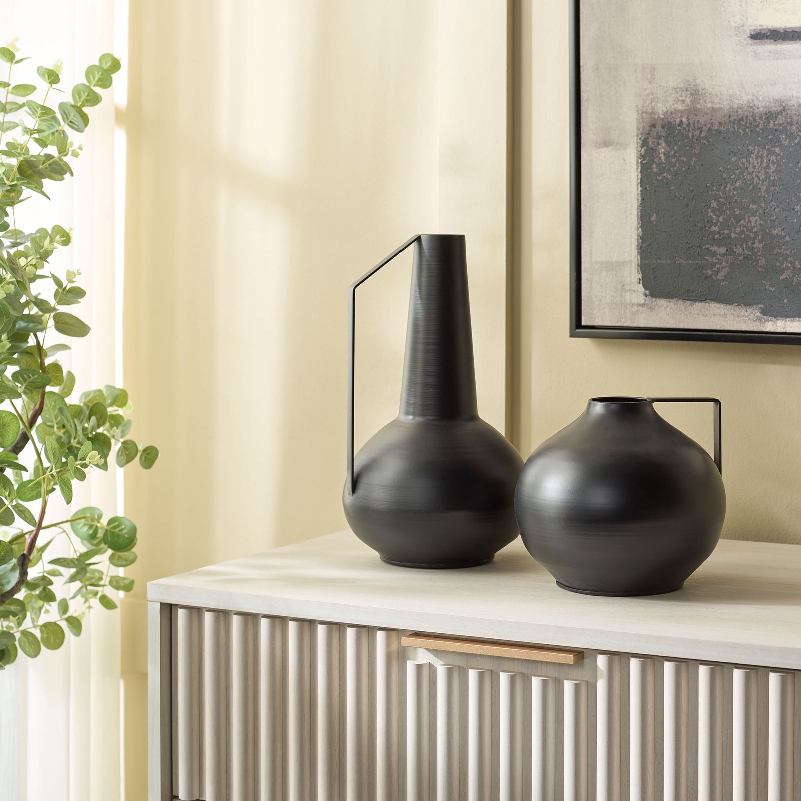 A tall tapered vase and rounded companion create an artful black iron display on a console || RDC4050A-SET2 || front_room