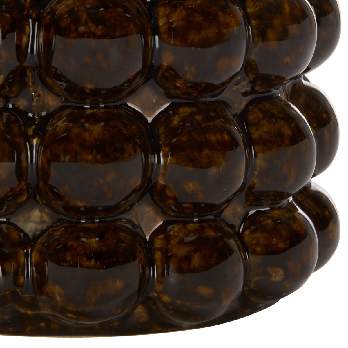 A gently rounded base meets rows of raised beads in a deep, glossy brown glaze.