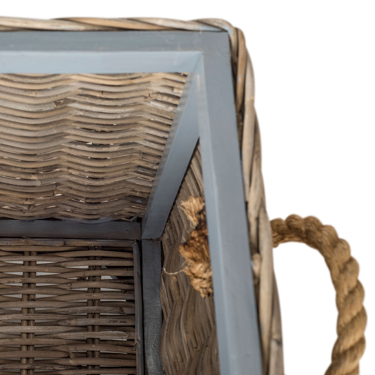 A sturdy gray frame reinforces the tightly woven rattan inside the storage trunk. || SEA7019A || detail_studio