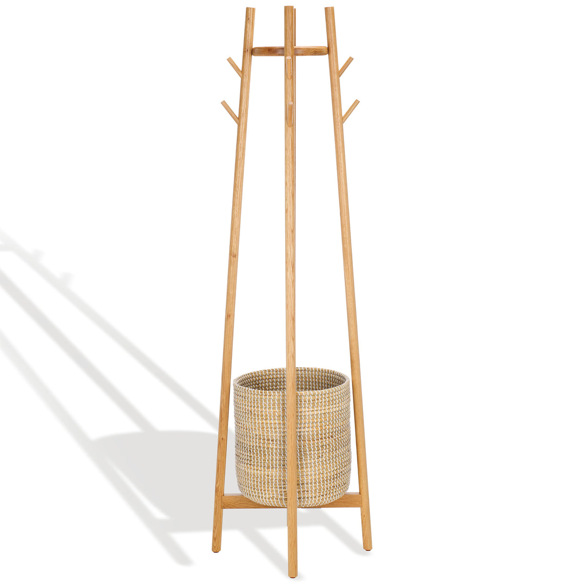 Slender, splayed wood uprights create a space-saving silhouette above a woven storage basket. || SFV4202A || side_studio