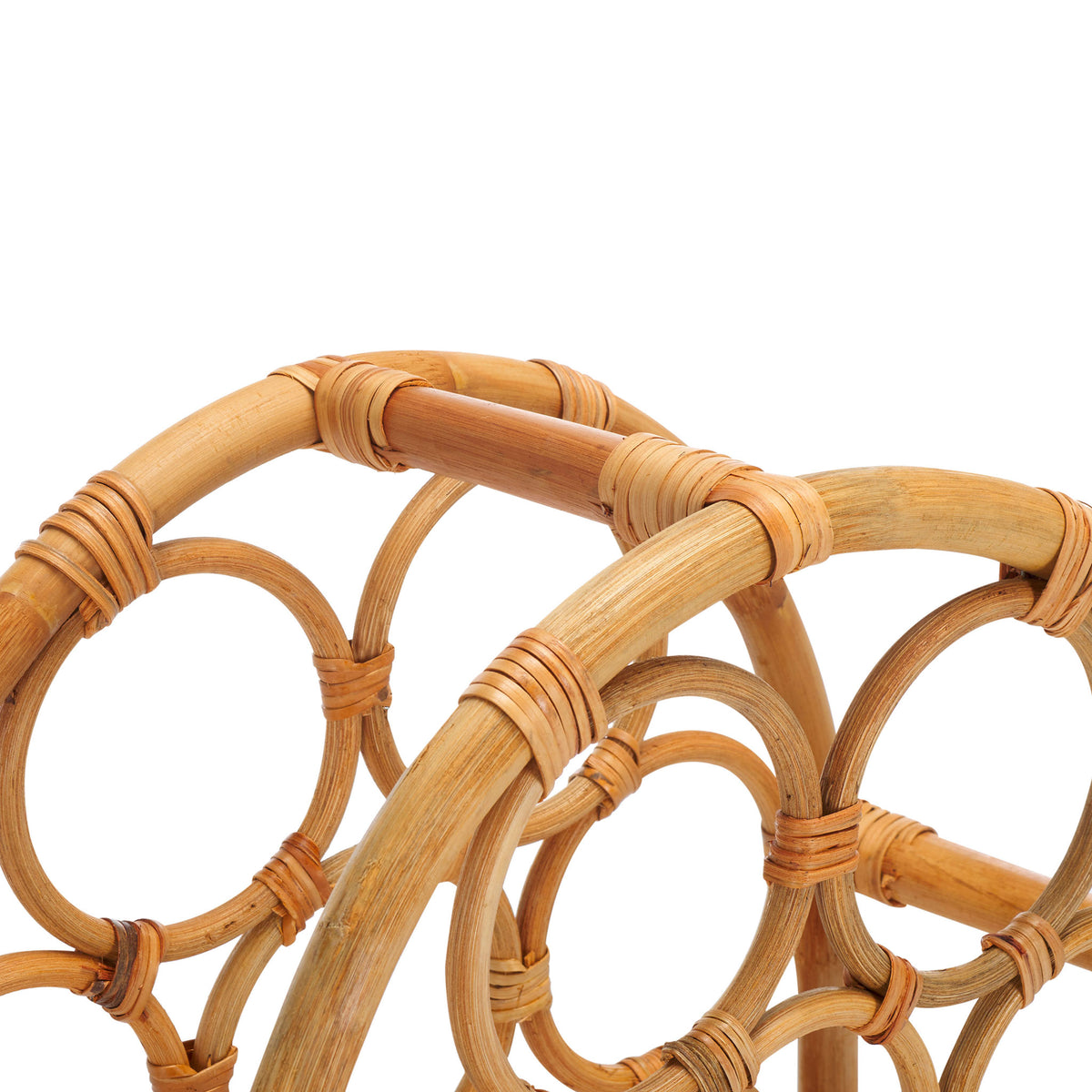 Curved rattan arches and tightly wrapped crossbars create a graceful frame
