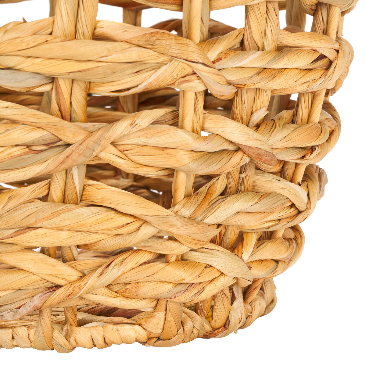 A wrapped base rim gives the natural-fiber basket a neat finish below its open weave. || STG1806A || leg_studio