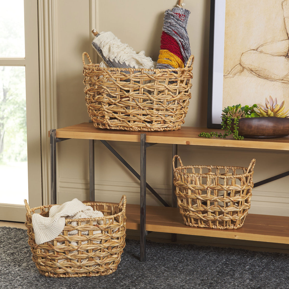 Three woven baskets keep throws and everyday essentials tidy while adding warmth to the room. || STG1806A || front_room