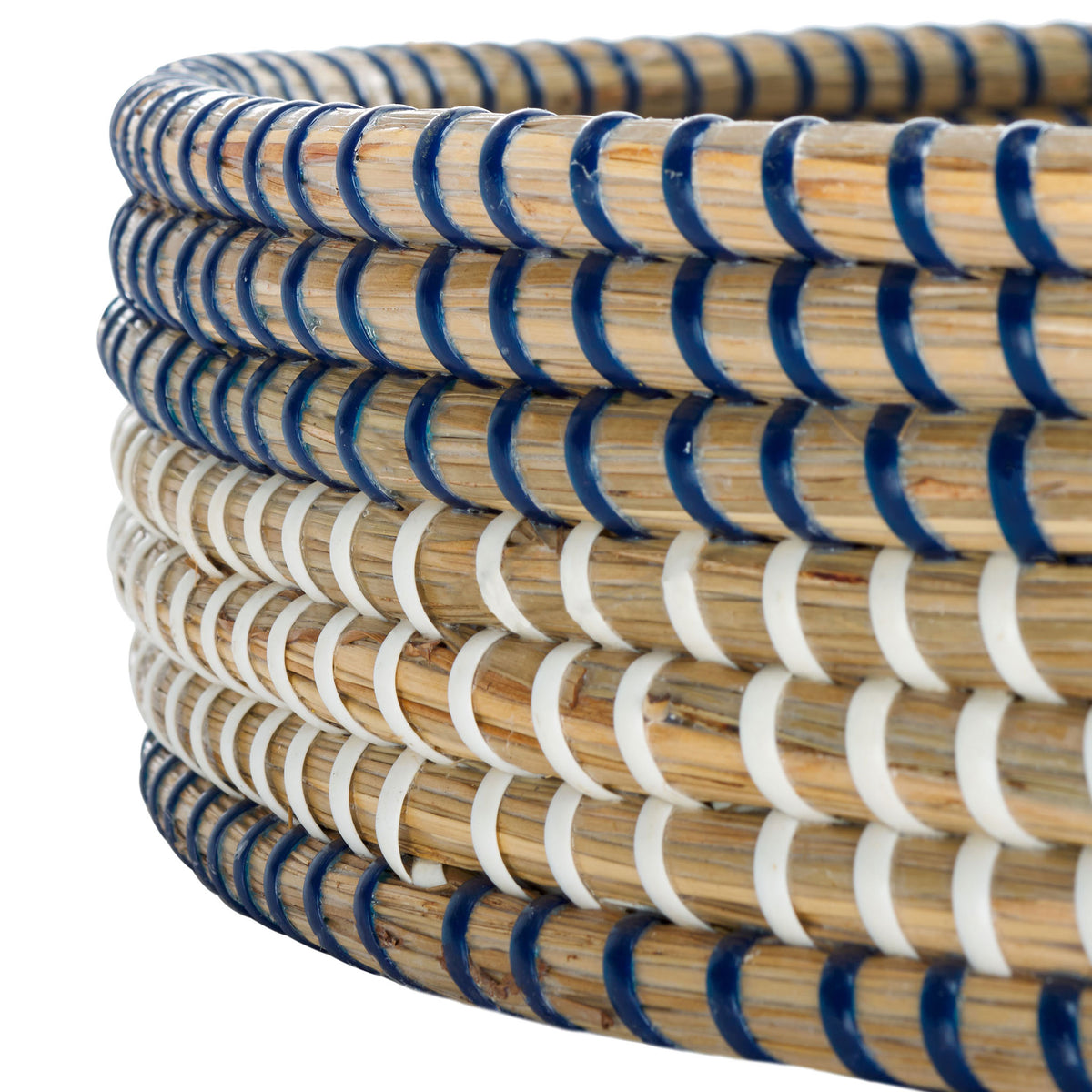 Blue and white wrapping accents layered seagrass coils along the tray's rim.